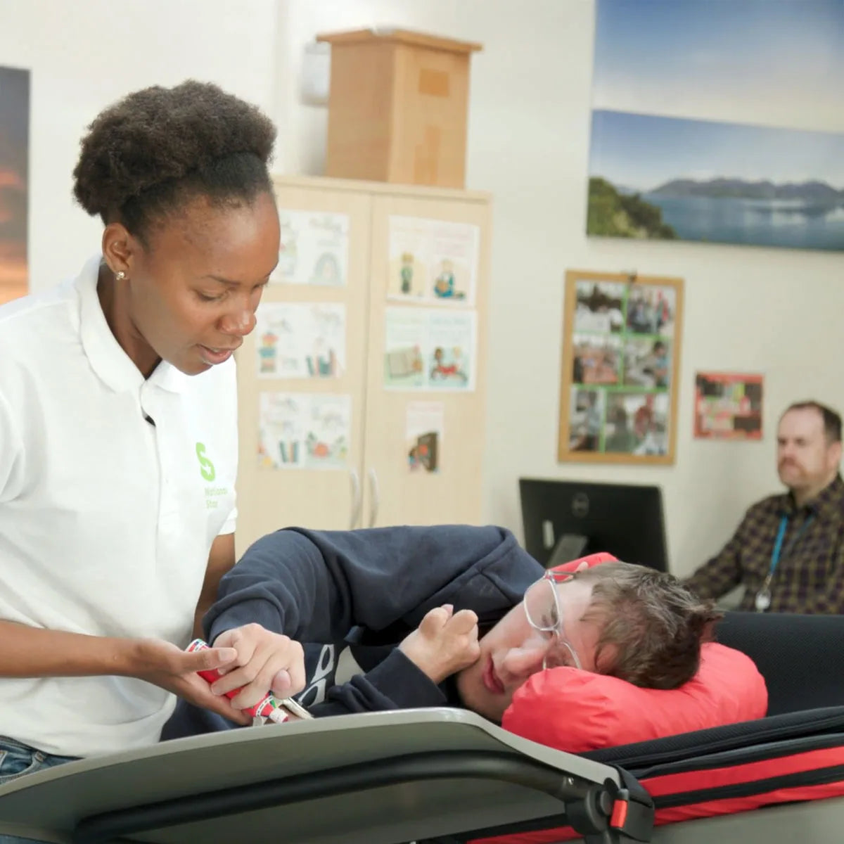 Person receiving a physical therapy from a therapist in a clinical setting.