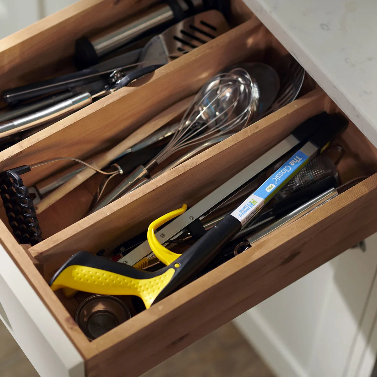 The pro folder reacher in a kitchen drawer