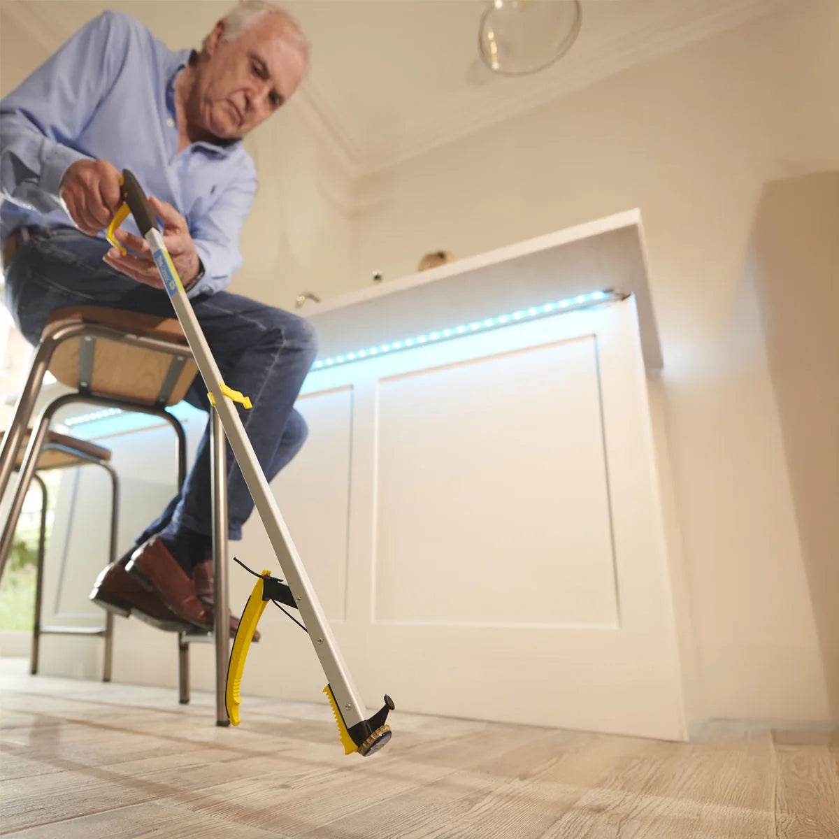 A man is using a pair of tongs