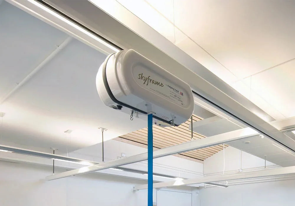 Ceiling-mounted skyframe system in an indoor setting.