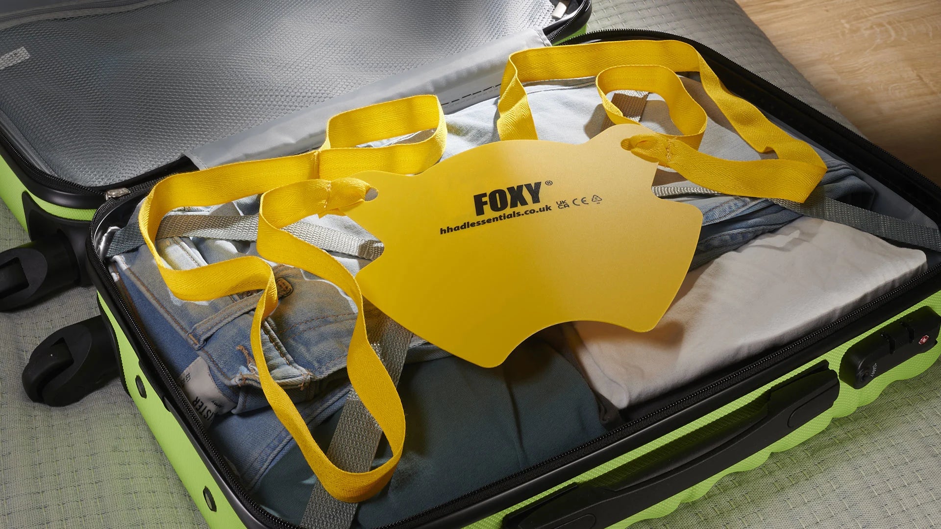 Foxy sock aid inside a suitcase