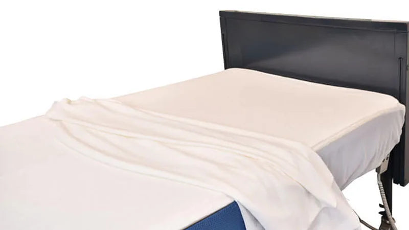 Mattress topper on a bed with a white background