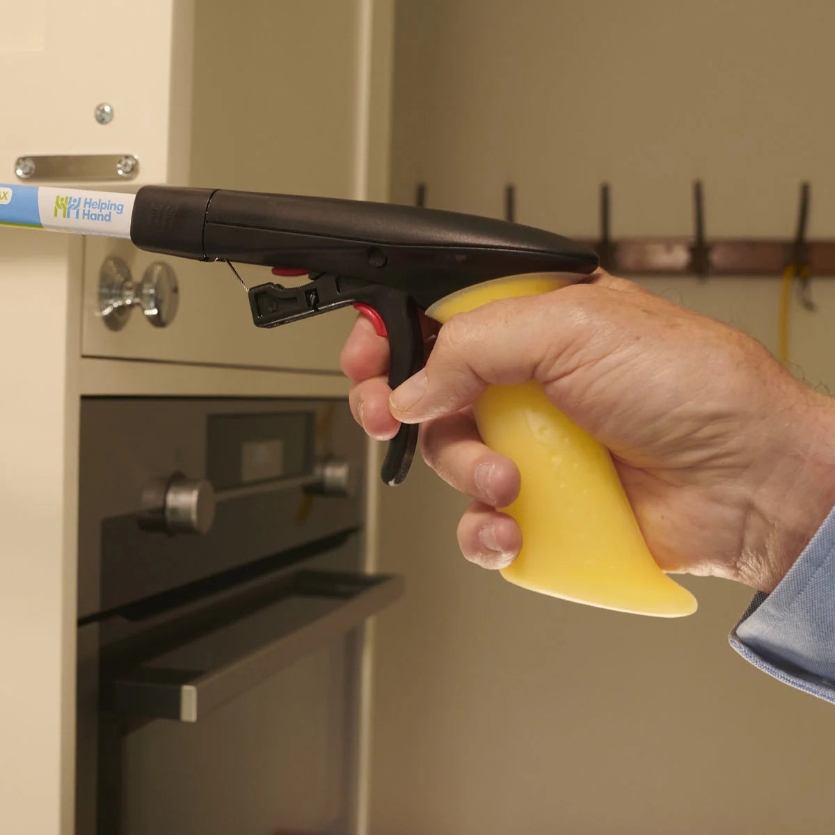 A person using a hand held tool