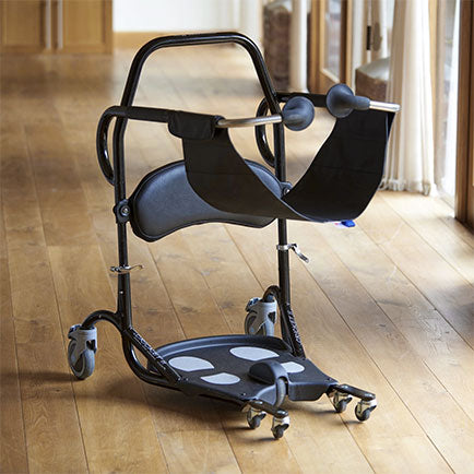 Black transfer chair with wheels on a wooden floor