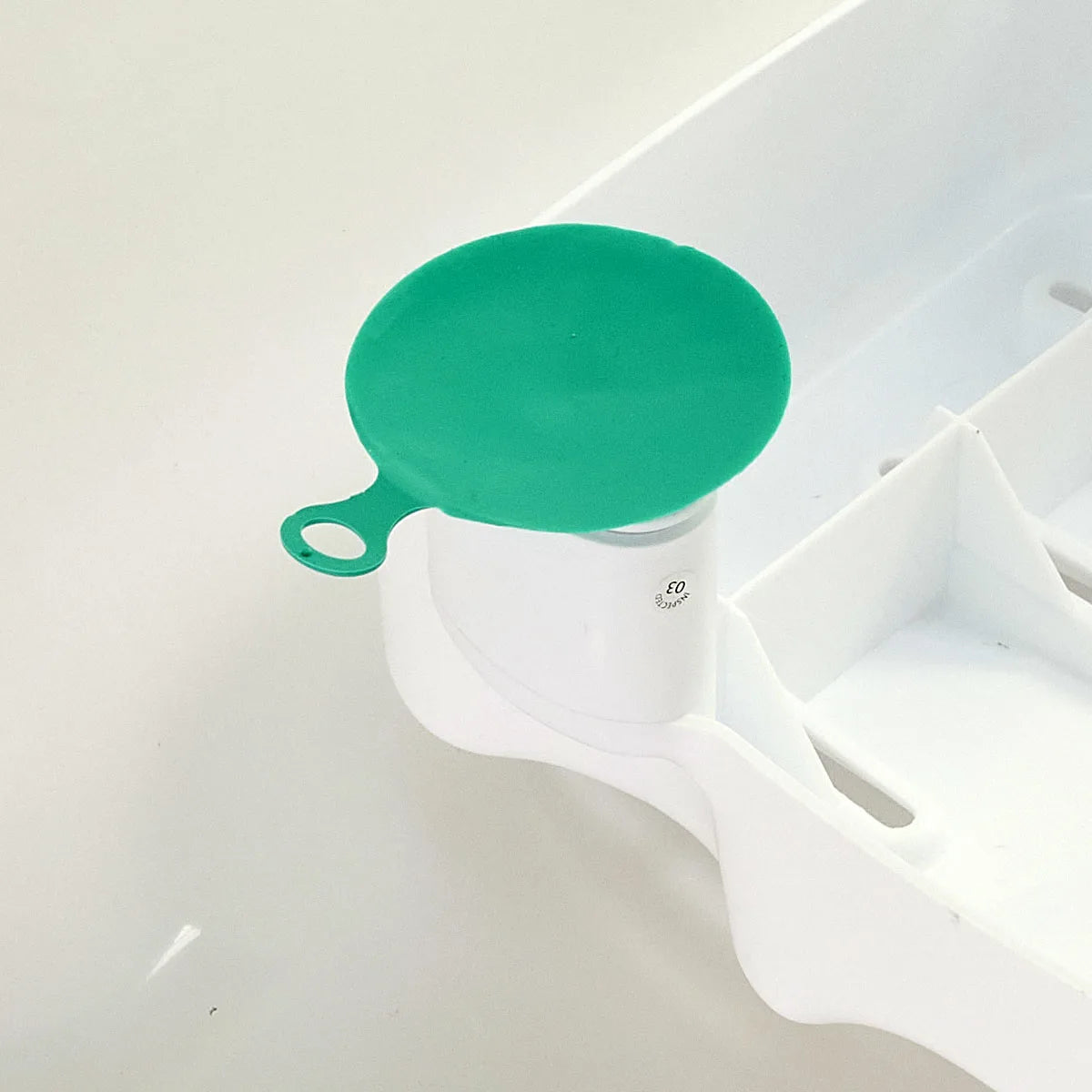 Green Suction cups on a bath seat