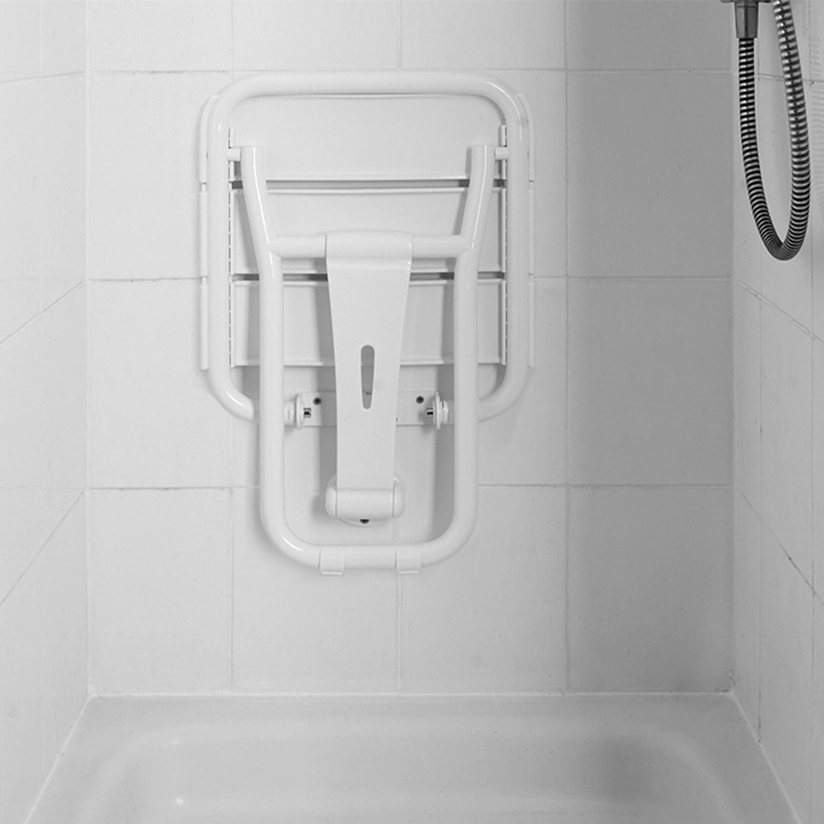 White shower seat mounted on a tiled bathroom wall.