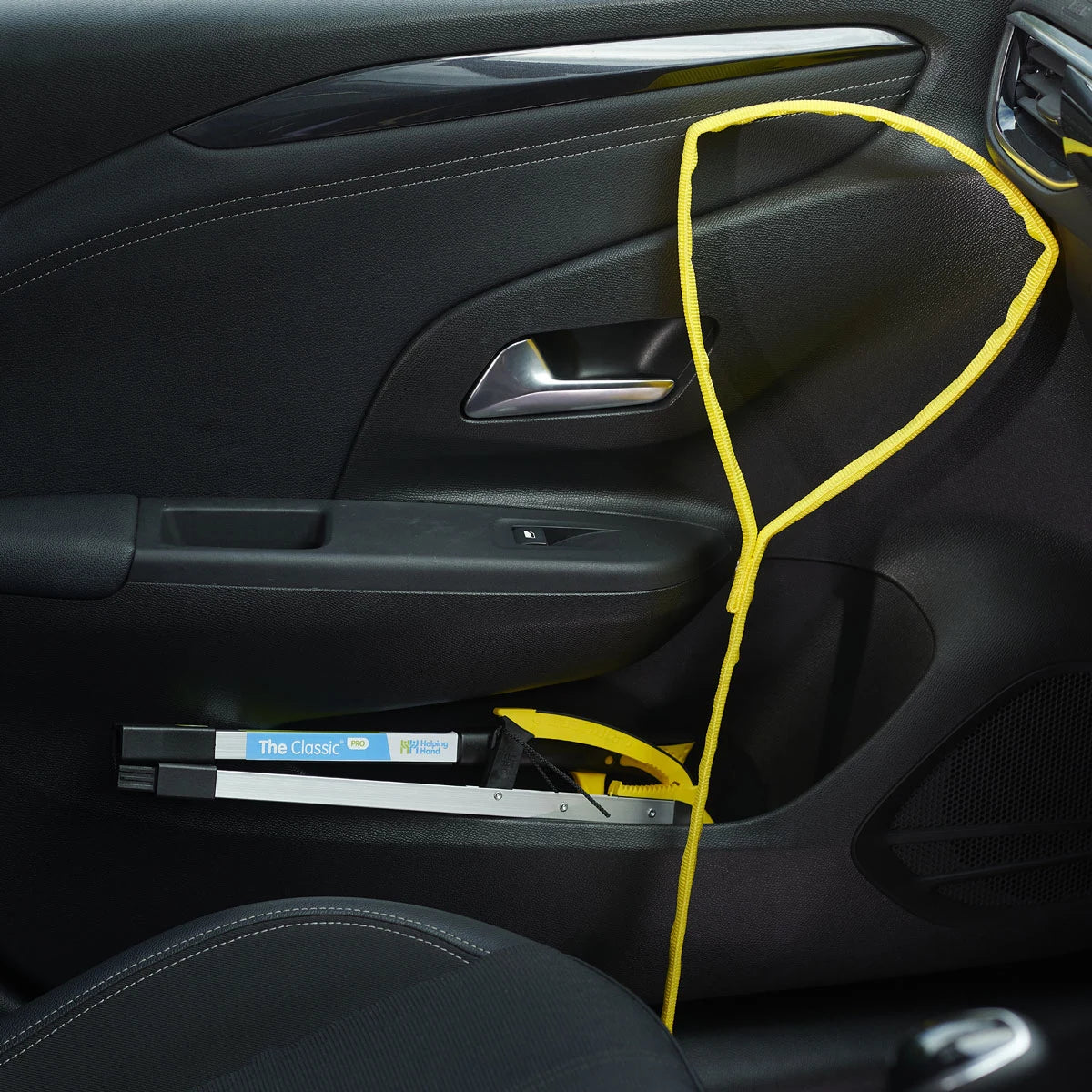 A yellow leg lifter inside a car