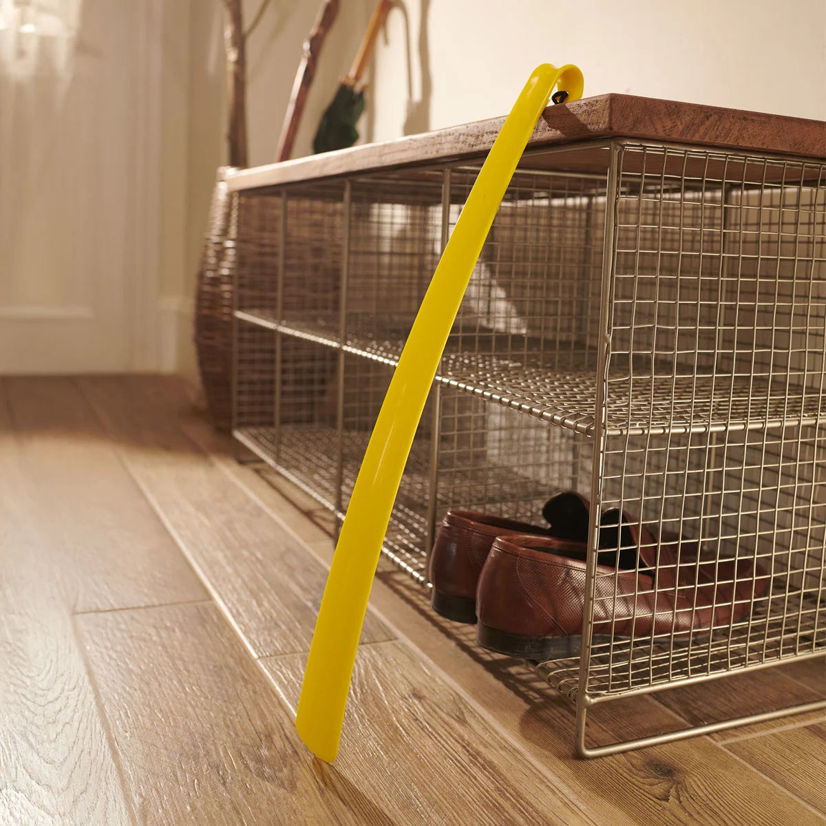 A yellow shoe horn