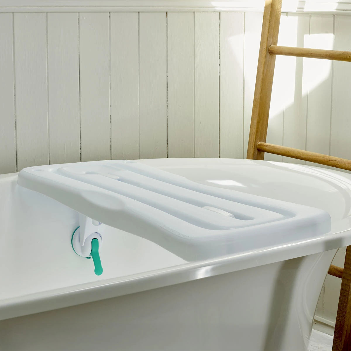White bathtub with a support device on it