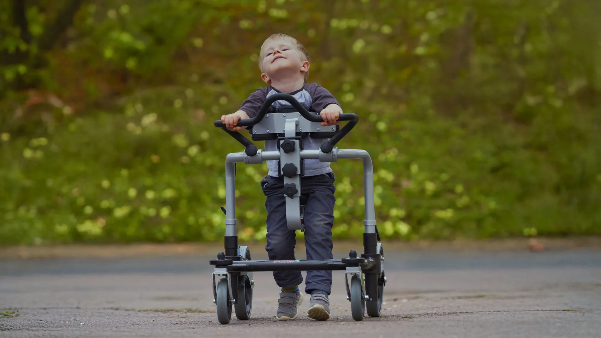 Testimonial of child using Meywalk gait trainer outside.