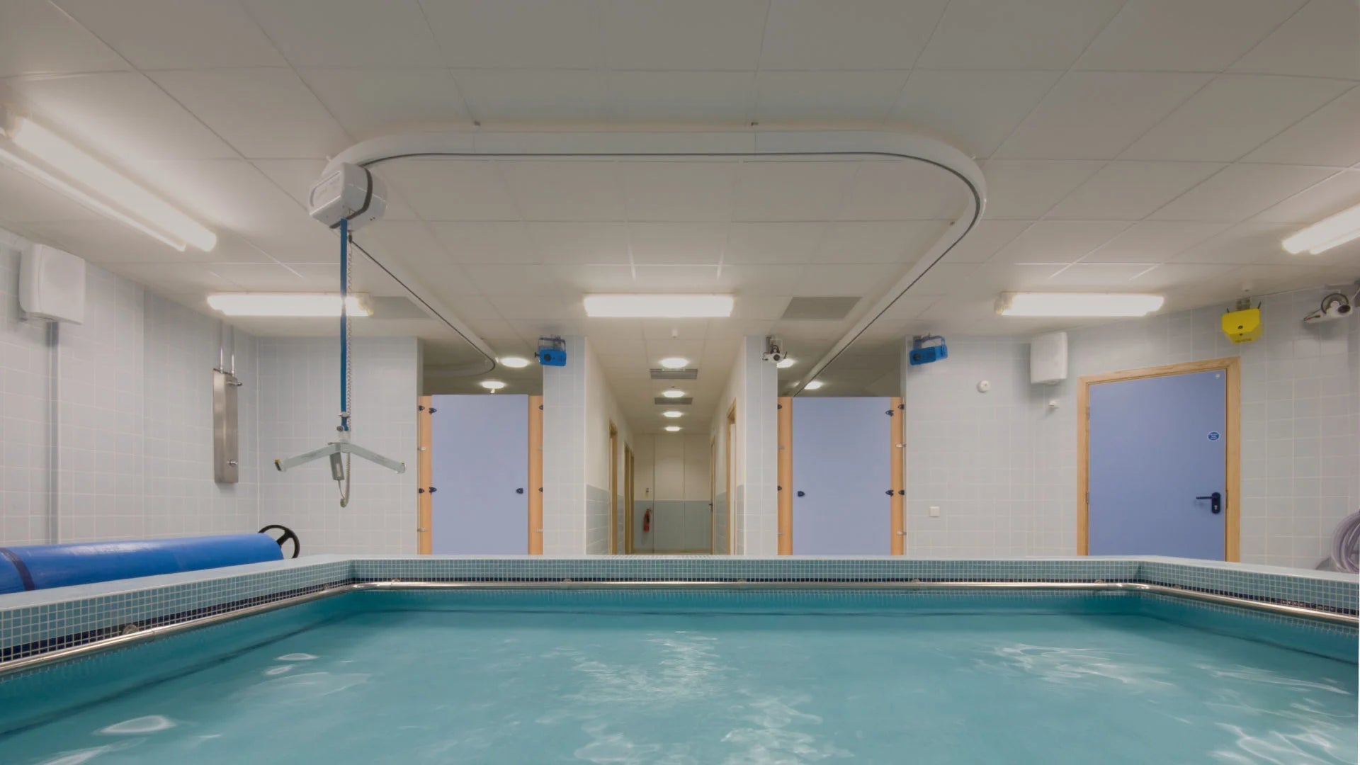 Skyframe mounted onto ceiling above Indoor pool.