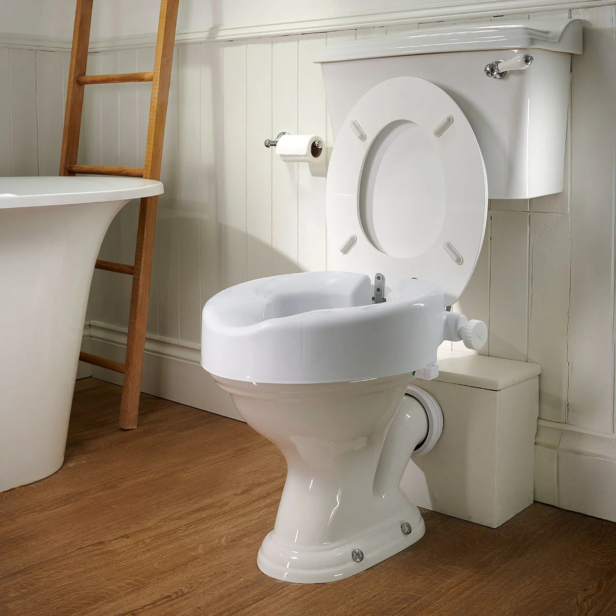 White toilet with a raised seat in a bathroom setting