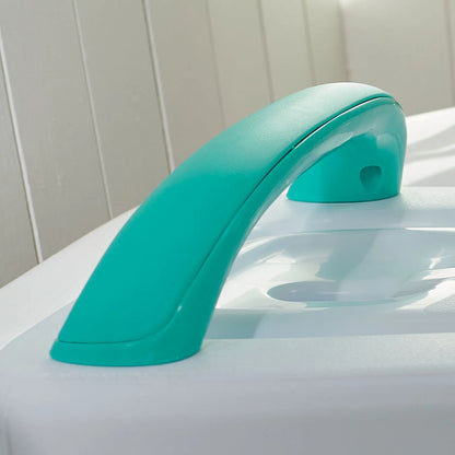 Turquoise bath handle on a white bath with a white wall background