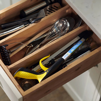 The pro folder reacher in a kitchen drawer