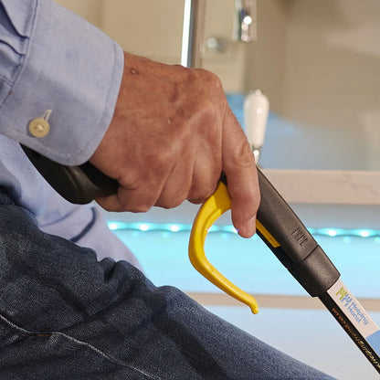 A person holding the handi grip pro reacher 